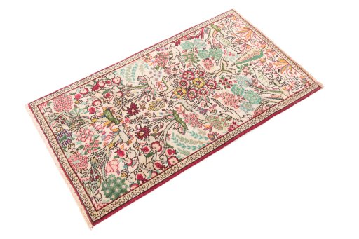 Corner detail of 2000s Tabriz rug showing border pattern and Wool pile