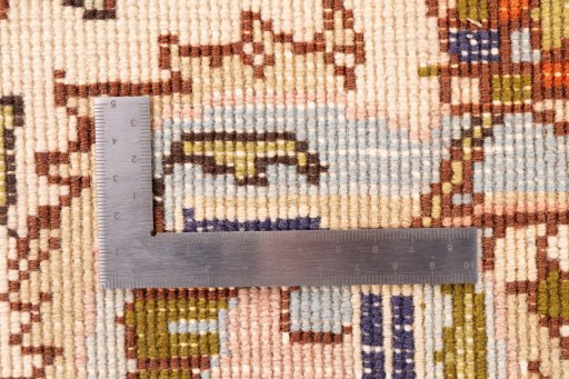 Corner detail of 2006s Tabriz rug showing border pattern and Wool pile