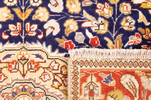 Close-up detail of 2006s Tabriz rug from Iran / Persia showing Wool weave