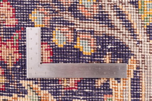 Corner detail of 2006s Tabriz rug showing border pattern and Wool pile