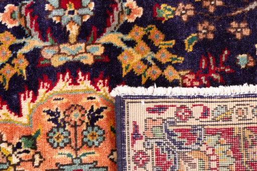 Close-up detail of 2006s Tabriz rug from Iran / Persia showing Wool weave