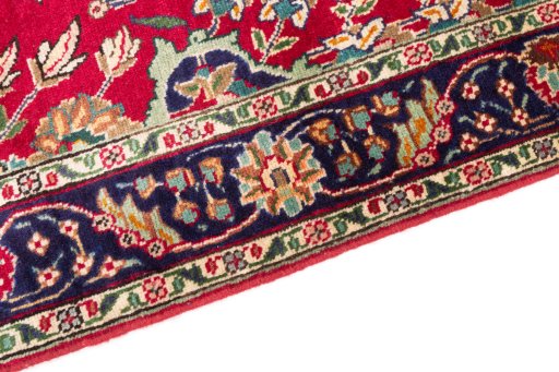 Backside of handmade 2002s Tabriz rug showing knot structure and weave density