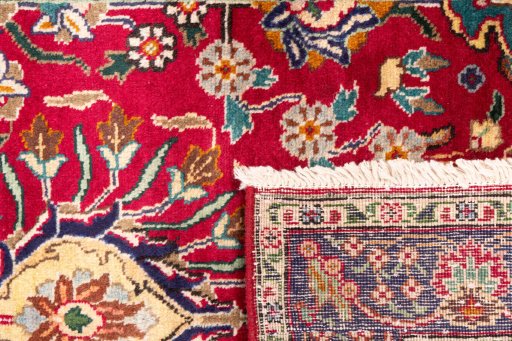 Close-up detail of 2002s Tabriz rug from Iran / Persia showing Wool weave