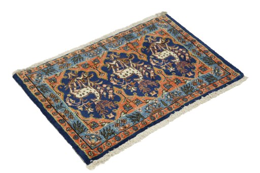 Corner detail of 1990s Tabriz rug showing border pattern and Wool pile