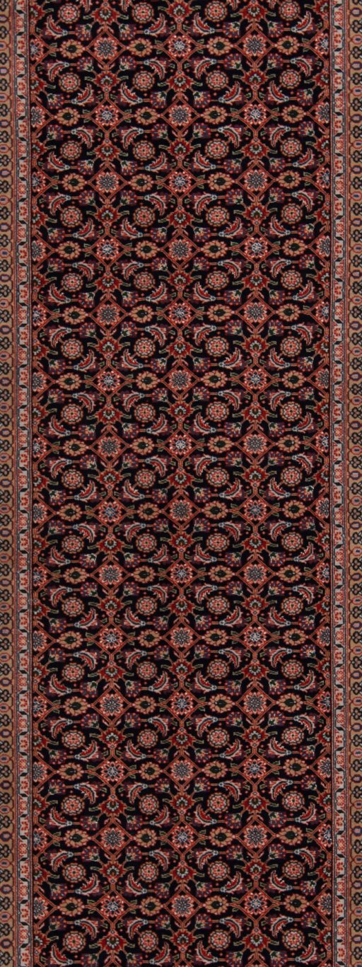 Backside of handmade New Tabriz rug showing knot structure and weave density