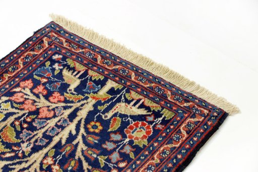Surface texture of 2000s Tabriz rug with natural Wool and intricate pattern