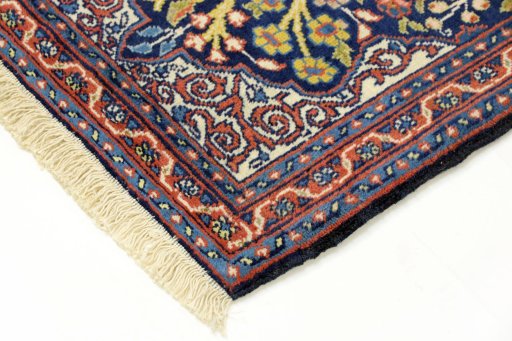 Backside of handmade 2000s Tabriz rug showing knot structure and weave density
