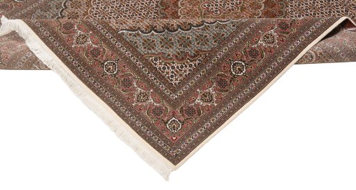 Backside of handmade New Tabriz rug showing knot structure and weave density