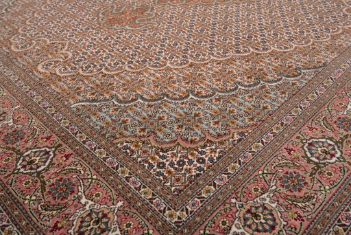 Corner detail of New Tabriz rug showing border pattern and Wool pile