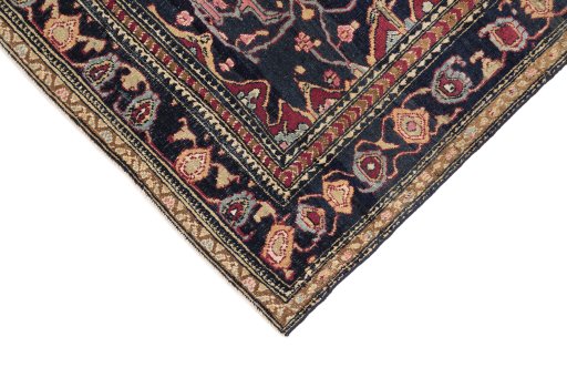 Backside of handmade 1900s Tehran rug showing knot structure and weave density