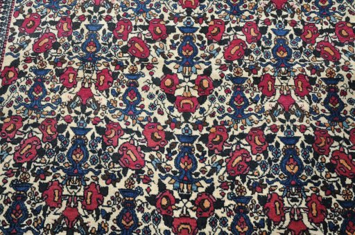 Backside of handmade 1930s Tehran rug showing knot structure and weave density