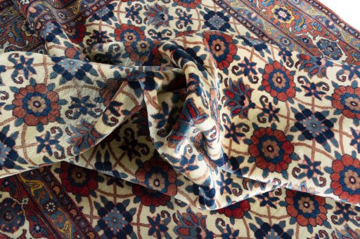 Corner detail of 2000s Varamin rug showing border pattern and Wool pile