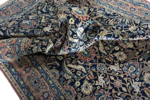 Surface texture of 2000s Varamin rug with natural Wool and intricate pattern