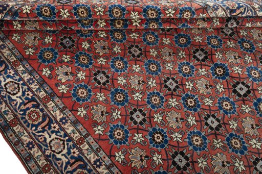 Close-up detail of 1950s Varamin rug from Iran / Persia showing Wool weave