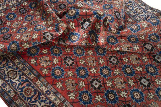 Surface texture of 1950s Varamin rug with natural Wool and intricate pattern