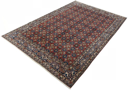 Corner detail of 1950s Varamin rug showing border pattern and Wool pile