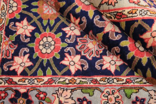 Corner detail of 1980s Varamin rug showing border pattern and Wool pile