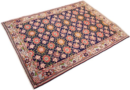 Corner detail of 1980s Varamin rug showing border pattern and Wool pile