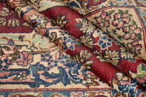 Corner detail of 1950s Yazd rug showing border pattern and Wool pile