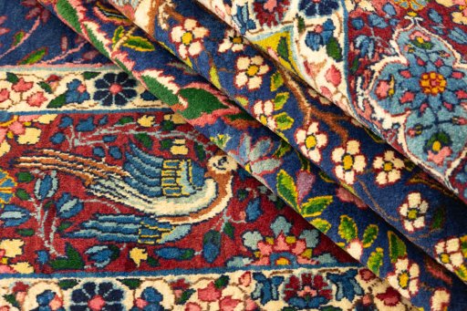 Corner detail of 1920s Yazd rug showing border pattern and Wool pile