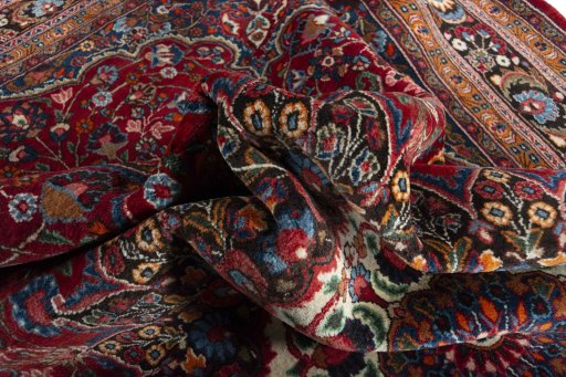 Surface texture of 2000s Yazd rug with natural Wool and intricate pattern