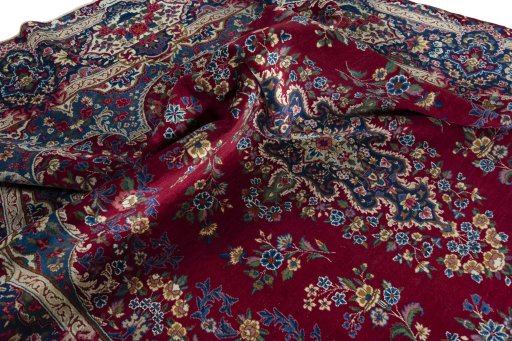Surface texture of 1970s Yazd rug with natural Wool and intricate pattern