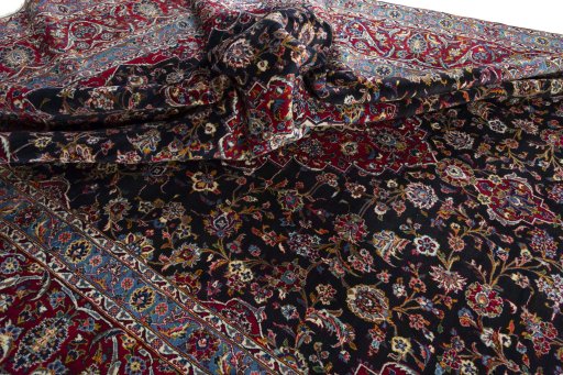Surface texture of 2000s Yazd rug with natural Wool and intricate pattern