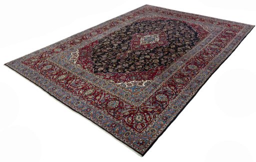 Corner detail of 2000s Yazd rug showing border pattern and Wool pile