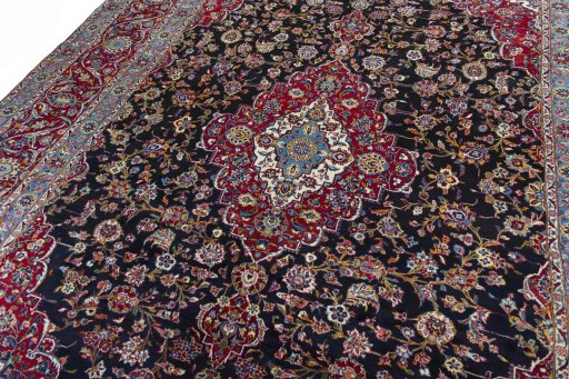Backside of handmade 2000s Yazd rug showing knot structure and weave density