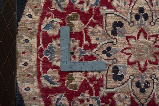 Backside of handmade 2000s Yazd rug showing knot structure and weave density