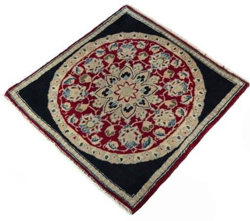 Corner detail of 2000s Yazd rug showing border pattern and Wool pile