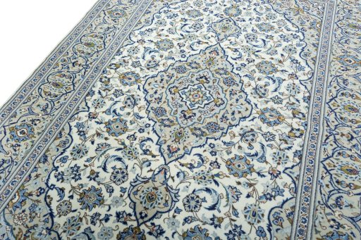 Backside of handmade 2000s Kashan rug showing knot structure and weave density
