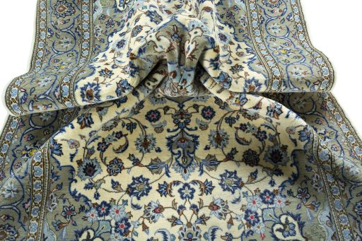 Surface texture of 2000s Kashan rug with natural Wool and intricate pattern