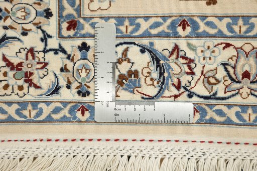 Corner detail of New Nain 6La with Silk rug showing border pattern and Wool pile