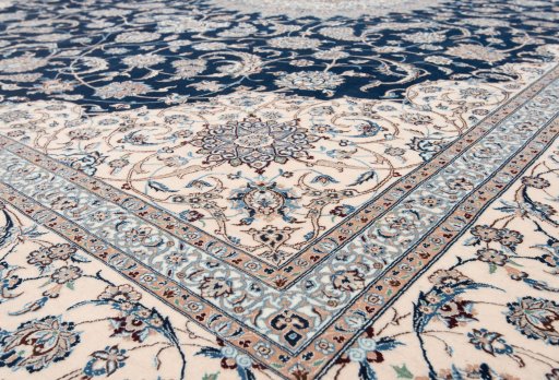 Corner detail of New Nain 6La with Silk rug showing border pattern and Wool pile