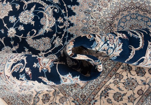 Corner detail of New Nain 6La with Silk rug showing border pattern and Wool pile