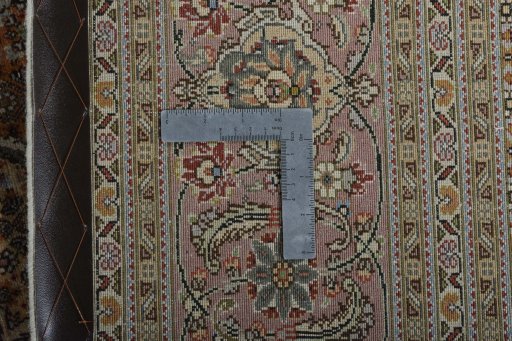 Backside of handmade New Tabriz 50/60/70 Raj rug showing knot structure and weave density