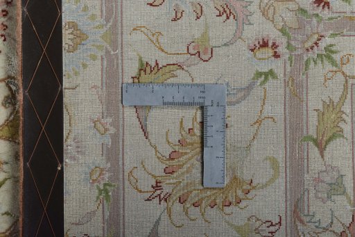 Backside of handmade New Tabriz 50/60/70 Raj rug showing knot structure and weave density