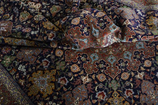 Backside of handmade 1970s Tabriz 50/60/70 Raj rug showing knot structure and weave density
