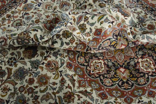 Backside of handmade New Tabriz 50/60/70 Raj rug showing knot structure and weave density