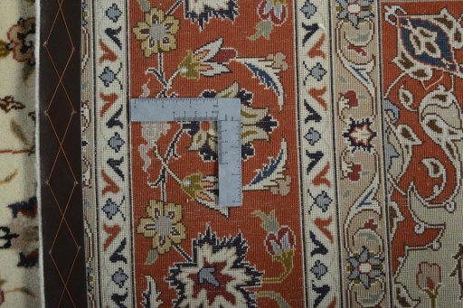 Backside of handmade New Tabriz 50/60/70 Raj rug showing knot structure and weave density
