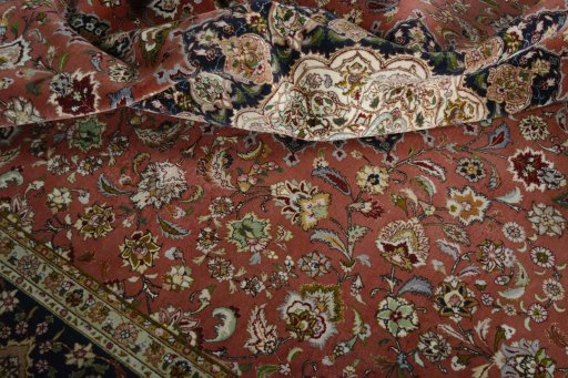 Backside of handmade New Tabriz 50/60/70 Raj rug showing knot structure and weave density