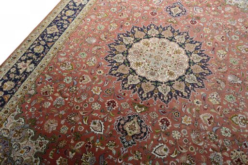 Backside of handmade New Tabriz 50/60/70 Raj rug showing knot structure and weave density