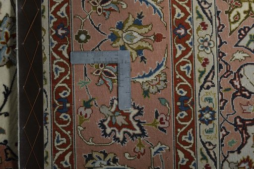 Backside of handmade New Tabriz 50/60/70 Raj rug showing knot structure and weave density