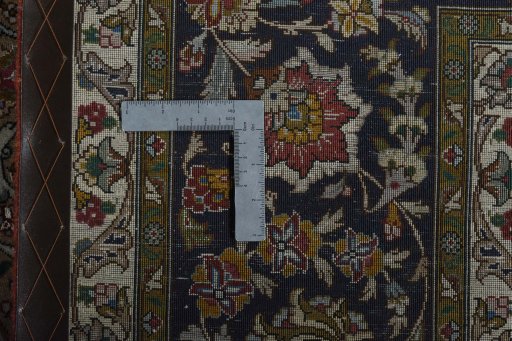 Backside of handmade New Tabriz 50/60/70 Raj rug showing knot structure and weave density