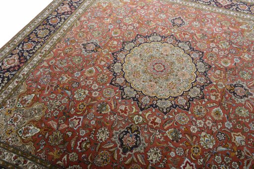 Backside of handmade New Tabriz 50/60/70 Raj rug showing knot structure and weave density