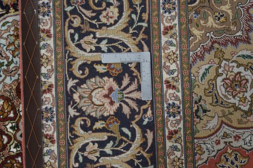 Backside of handmade New Tabriz 50/60/70 Raj rug showing knot structure and weave density