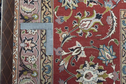 Backside of handmade New Tabriz 50/60/70 Raj rug showing knot structure and weave density