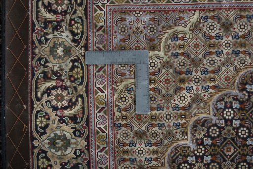 Backside of handmade New Tabriz 50/60/70 Raj rug showing knot structure and weave density