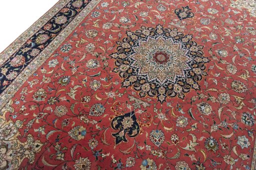 Backside of handmade New Tabriz 50/60/70 Raj rug showing knot structure and weave density